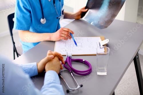 Family doctor spends consultation in the office