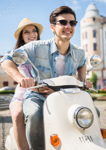 Young couple on scooter