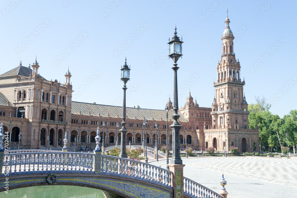 Fototapeta premium Bridge, lamp post and tower at Spain square