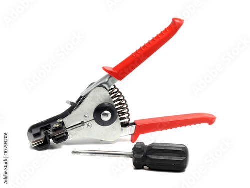 solid insulation stripper and screwdriver on a white background