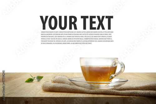 Cup of tea with sacking on the wooden table, isolated white back
