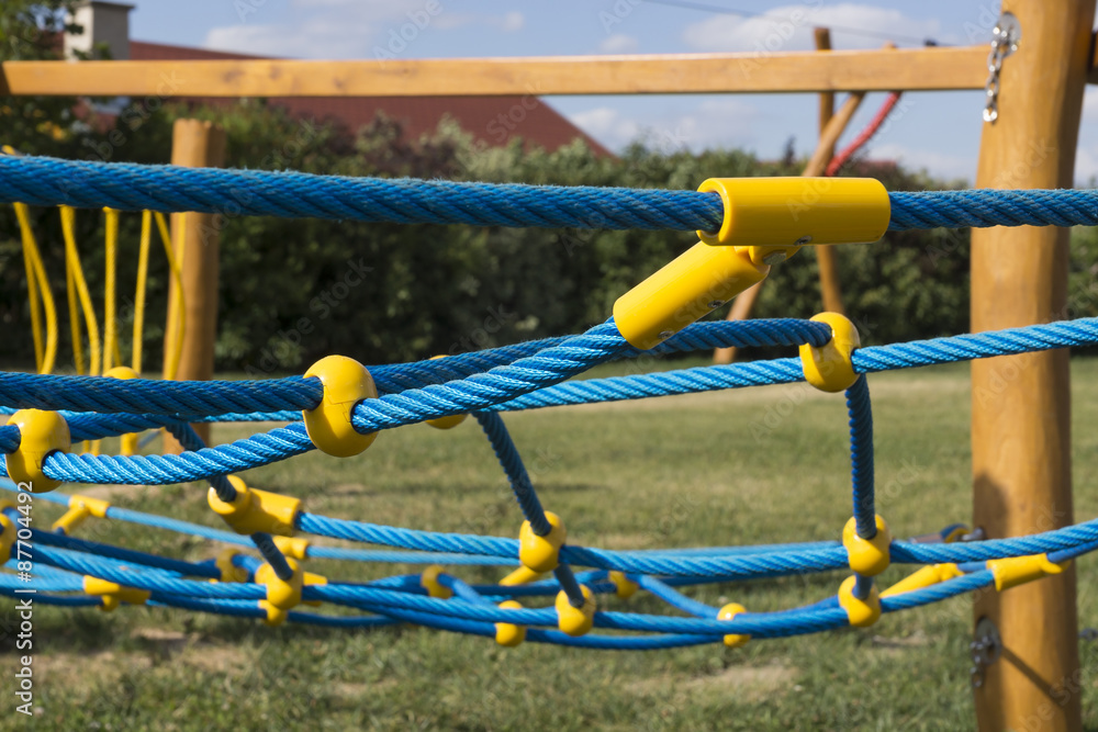 yellow and blue rope-climbing frame in the playground