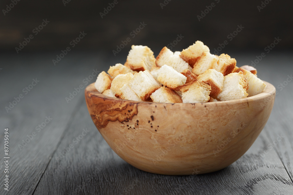 homemade croutons from white bread in wood bowl homemade croutons from white bread in wood bowl