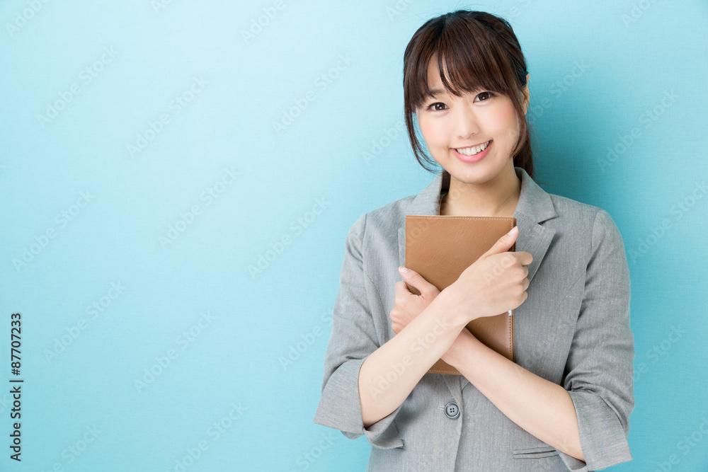 portrait of asian businesswoman on blue background portrait of asian businesswoman on blue background