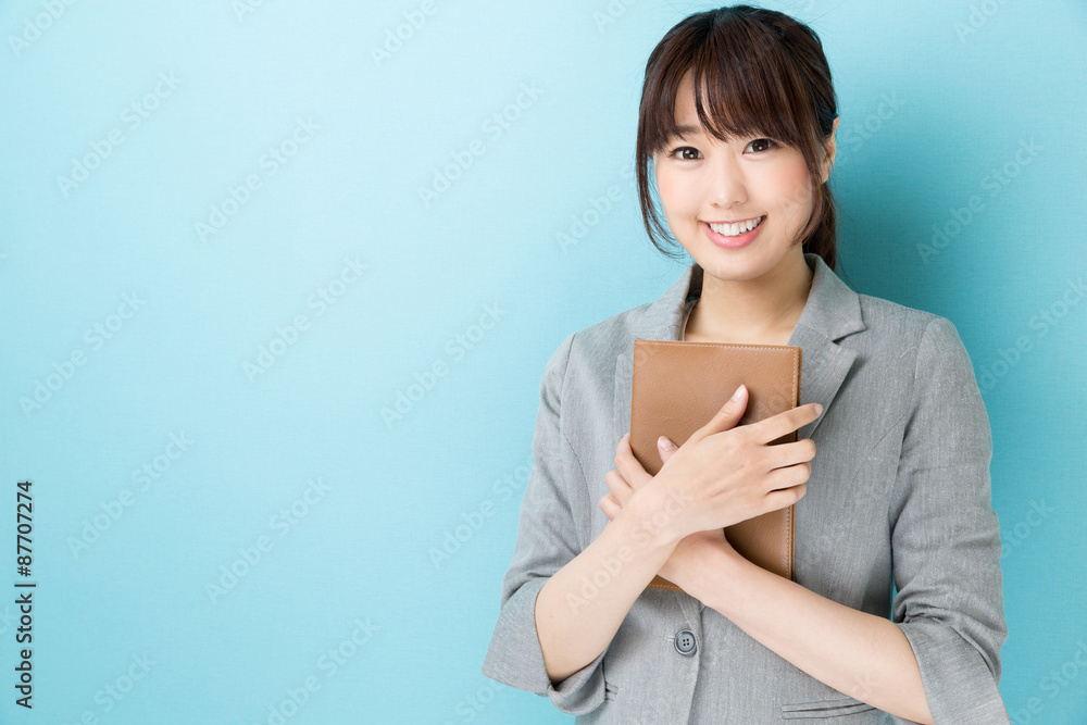 portrait of asian businesswoman on blue background portrait of asian businesswoman on blue background