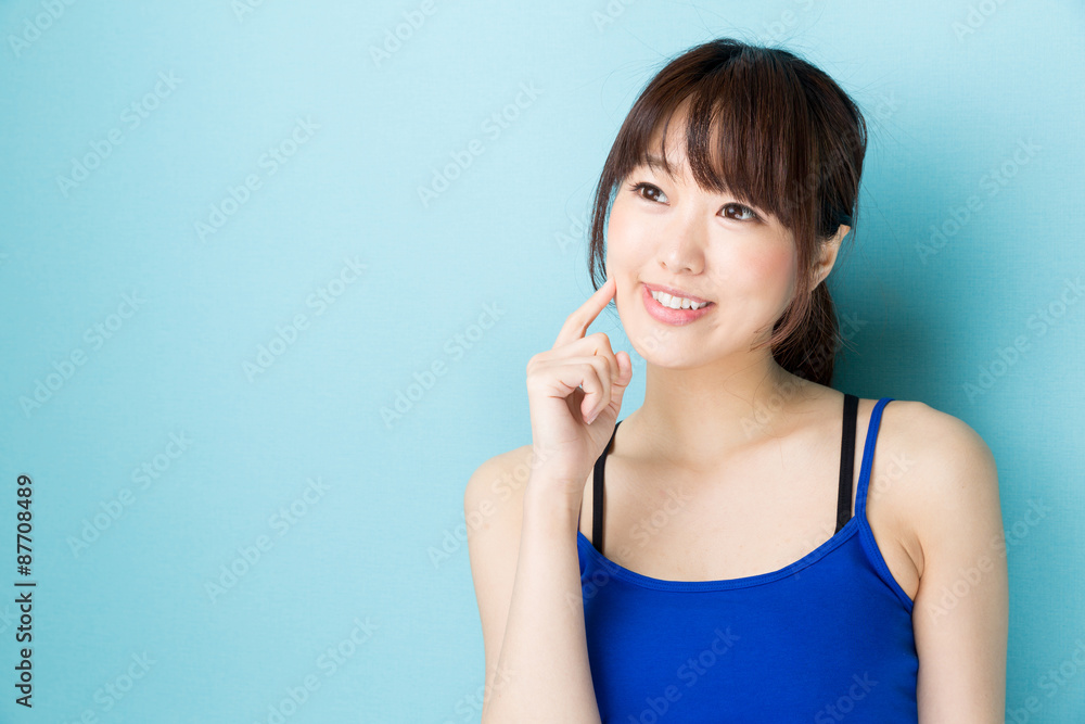 attractive asian woman beauty image on blue background attractive asian woman beauty image on blue background
