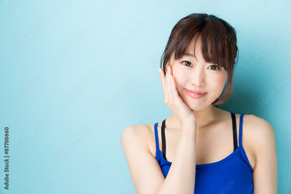 attractive asian woman beauty image on blue background attractive asian woman beauty image on blue background
