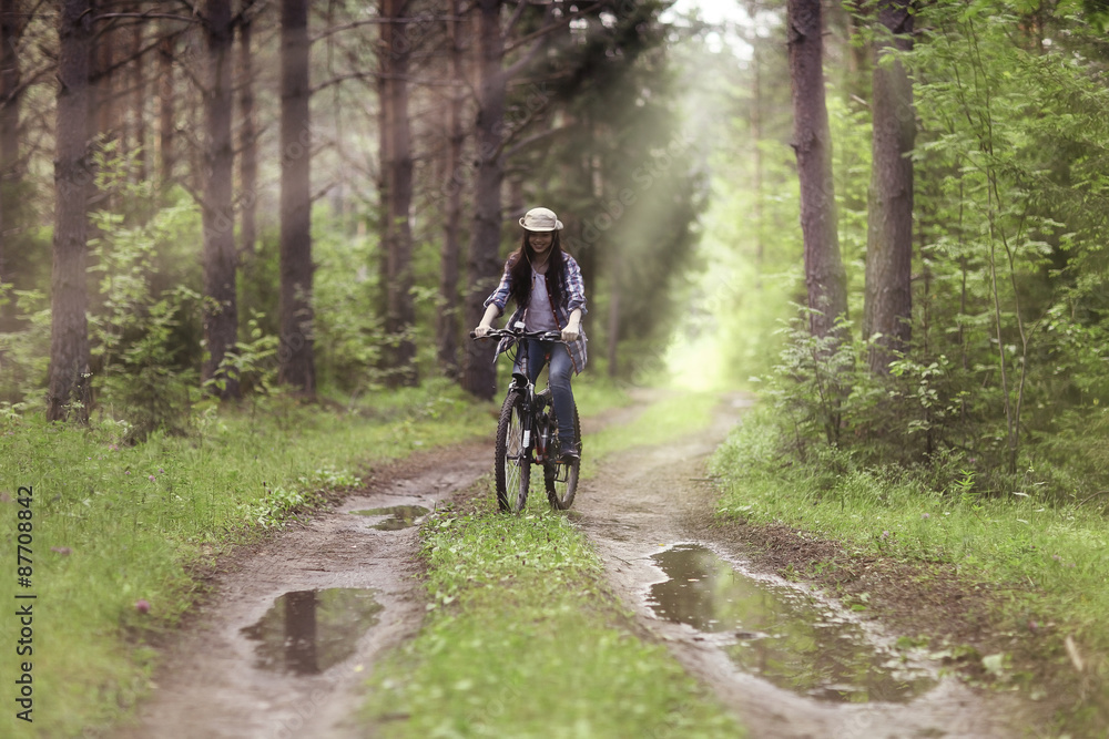 Beautiful girl in the forest landscape with sun rays Beautiful girl in the forest landscape with sun rays