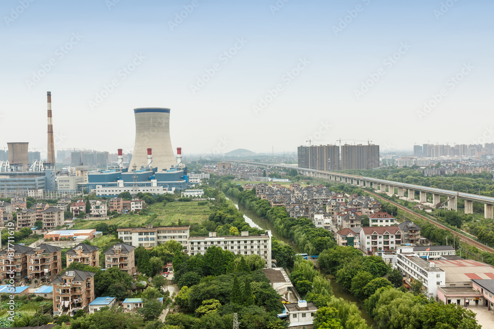 Fototapeta premium Power plants in residential areas aerial view