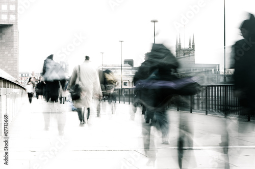 Bleached commuters. High key, abstract captures of business commuters during early morning London rush hour.  Long exposure creating a motion blur to emulate the movement of the scene.