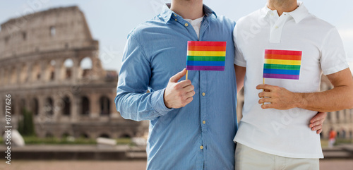 Canvas Print close up of male gay couple with rainbow flags