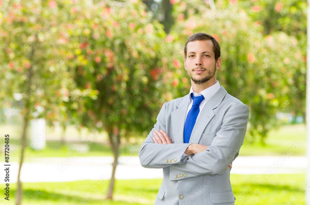 Handsome successful businessman professional in grey suit posing Handsome successful businessman professional in grey suit posing