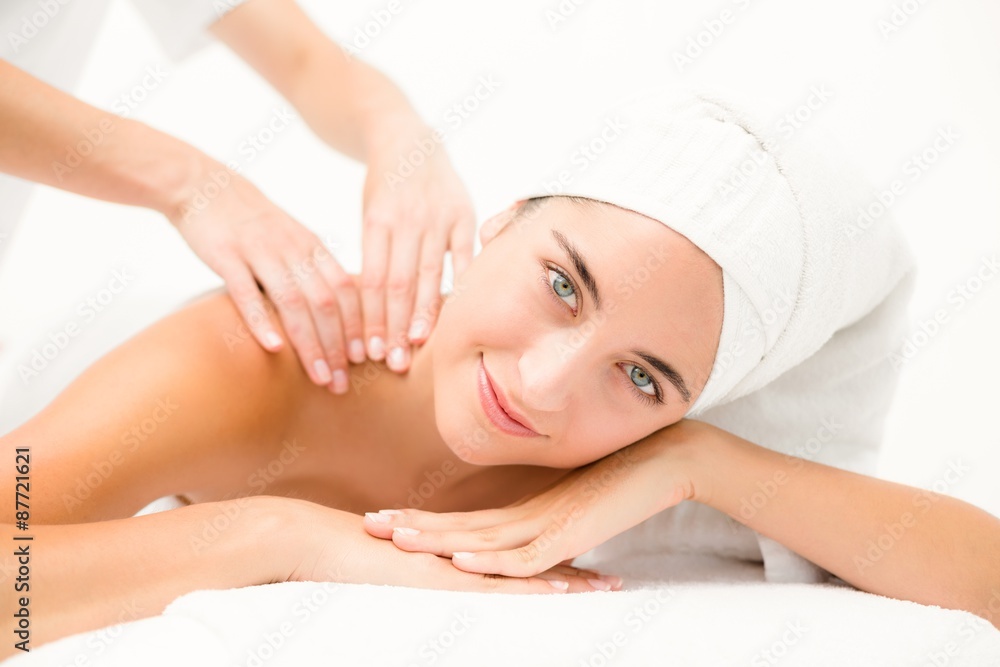 Attractive young woman receiving shoulder massage Attractive young woman receiving shoulder massage