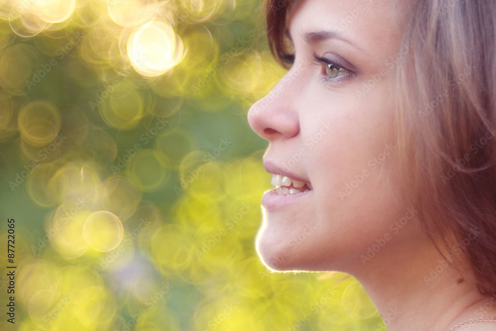 Fototapeta premium portrait of a beautiful brunette at sunset