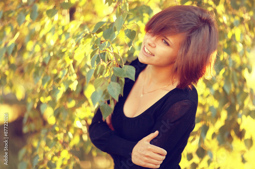 Spring portrait of a young girl in a park outside