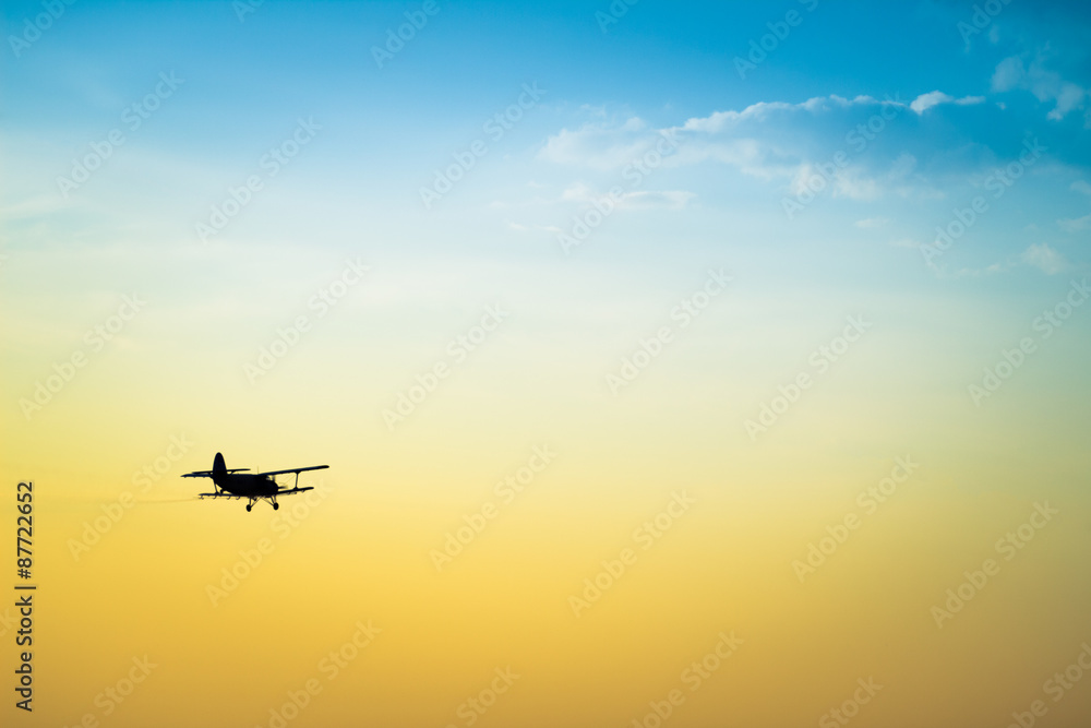 aircraft flying in the sky spraying mosquitoes