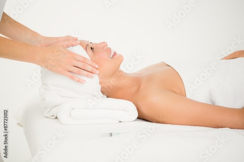 Attractive woman receiving facial massage