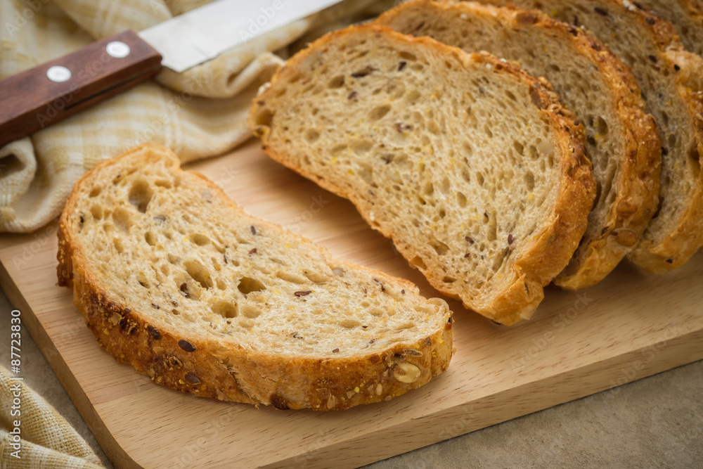 Whole grain bread on chopping board