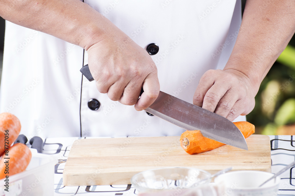 Chef is cutting carrots Chef is cutting carrots