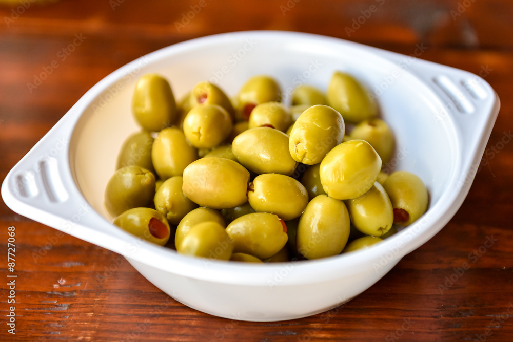 Plactic bowl of green olives Plactic bowl of green olives