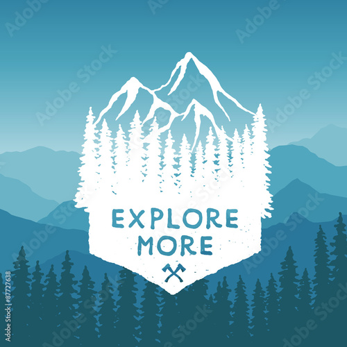 hand drawn wilderness typography poster with mountains and pine trees. explore more. artwork for hipster wear. vector Inspirational illustration on mountain background
