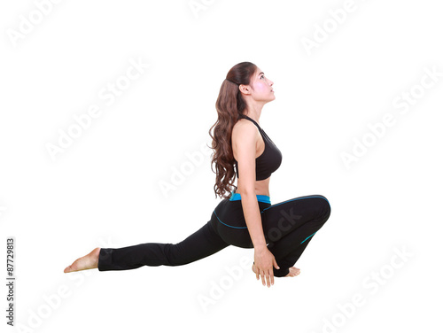 Young woman doing yoga exercise