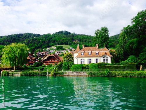 view of house in thun lake in switzerland