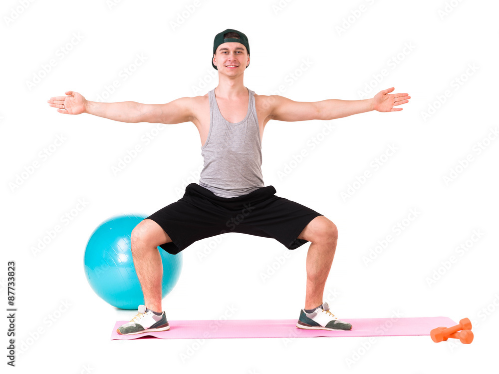 Full length portrait of a fit young man over white background