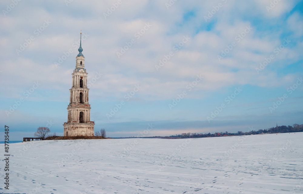 Ancient bell tower of the temple of the flooded waters of the Volga River