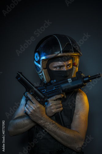 Weapon, murderer with motorcycle helmet and guns