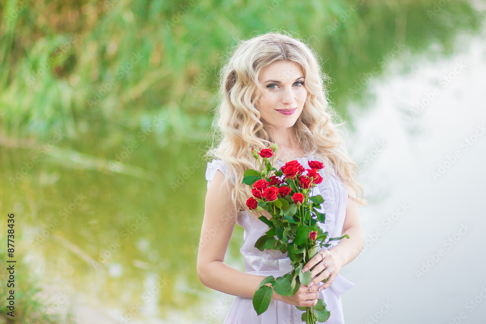 beauty woman portrait with a bouquet of red roses beauty woman portrait with a bouquet of red roses