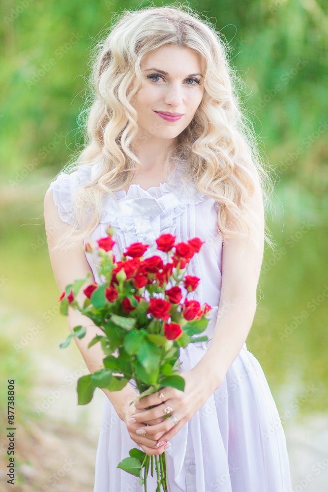 beauty woman portrait with a bouquet of red roses beauty woman portrait with a bouquet of red roses