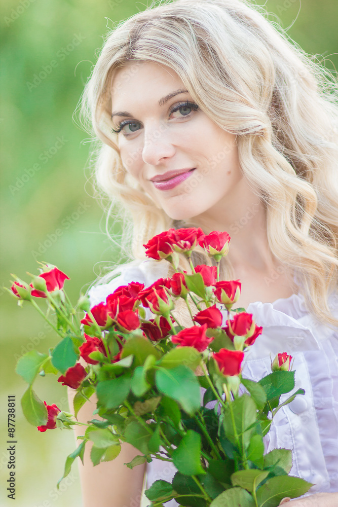 beauty woman portrait with a bouquet of red roses beauty woman portrait with a bouquet of red roses