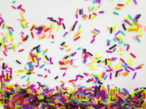 Festive colorful confetti on white background