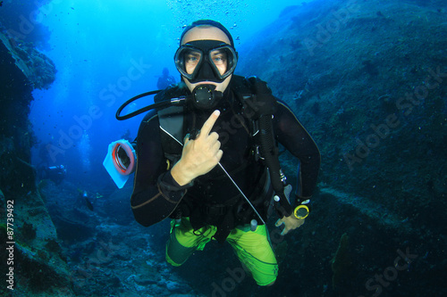 Scuba diver explores underwater cave