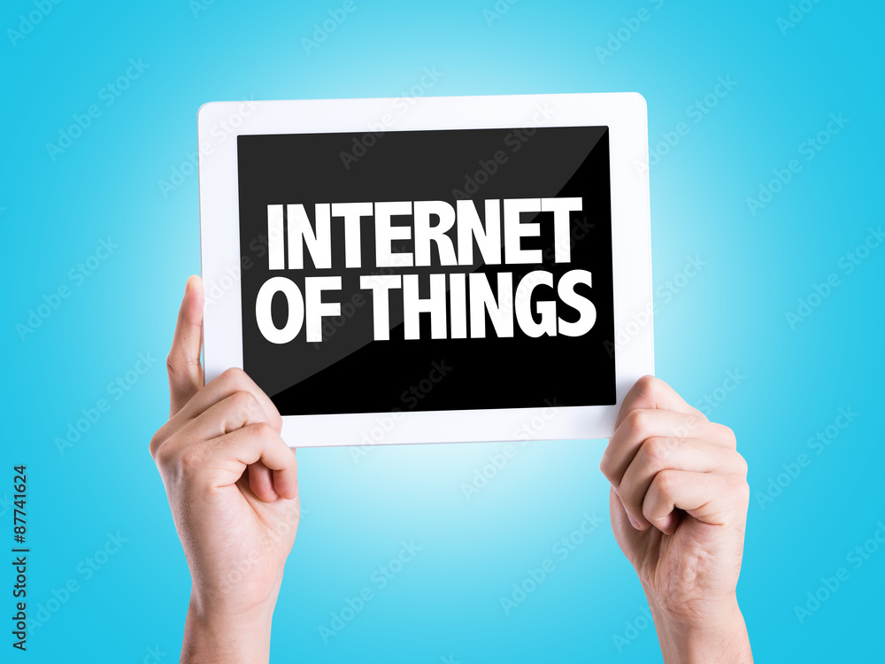 Tablet pc with text Internet of Things with blue background Tablet pc with text Internet of Things with blue background