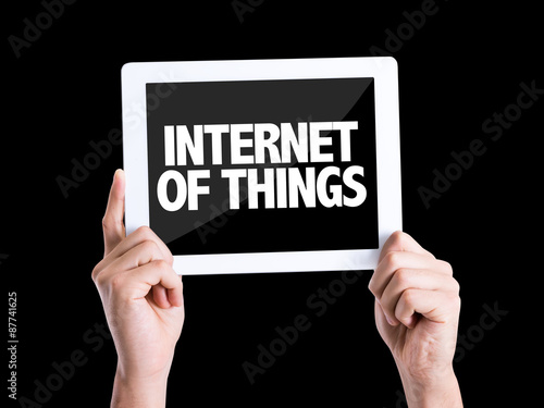 Tablet pc with text Internet of Things isolated on black