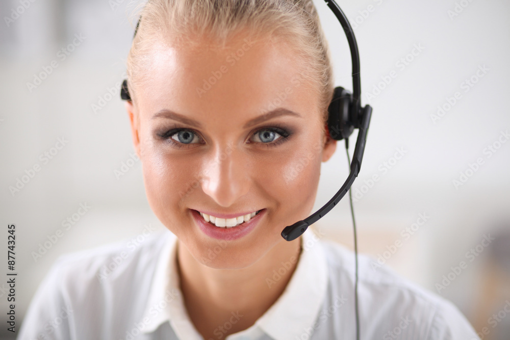 Close-up portrait of a customer service agent sitting at office Close-up portrait of a customer service agent sitting at office