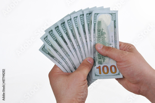 Hands holding dollar cash