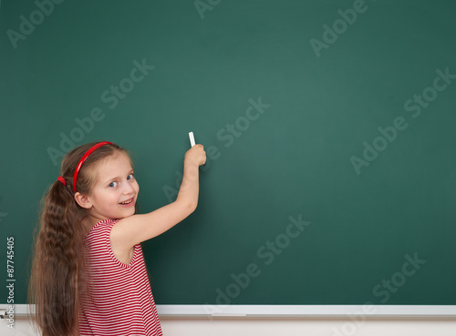 Schoolgirl write on school board