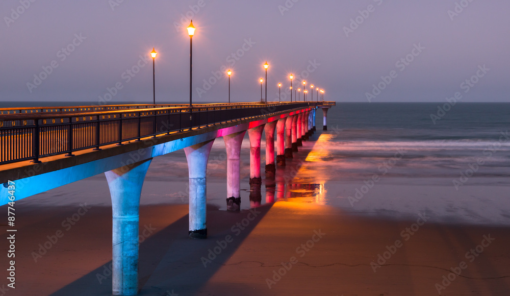 Decorative lighting of a pier at twilight