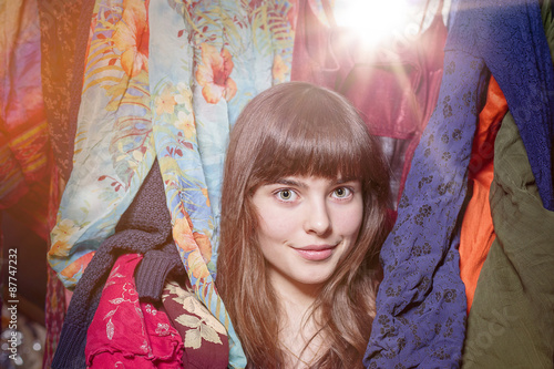 portrait of a beautiful teenage girl and her wardrobe, with boke