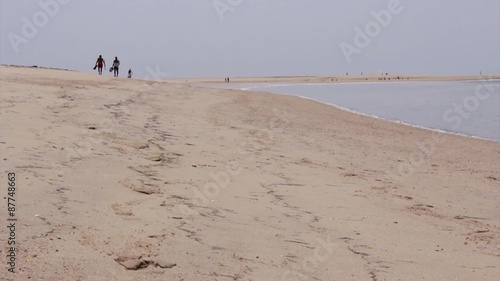 Tourists at Armona cost beach, Algarve, southern Portugal.