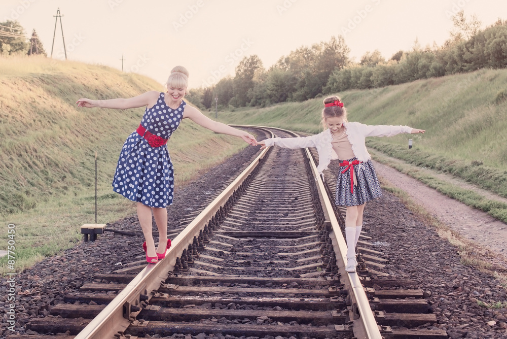 Mother with the daughter go on rails Mother with the daughter go on rails