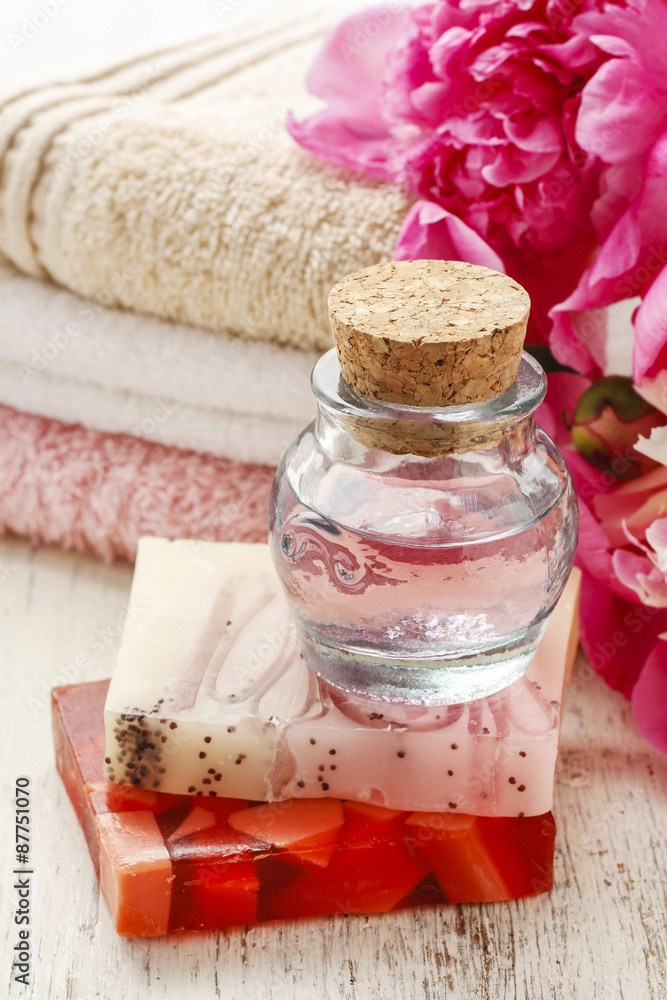 Bottle of essential oil and bars of natural handmade soap, Bottle of essential oil and bars of natural handmade soap,