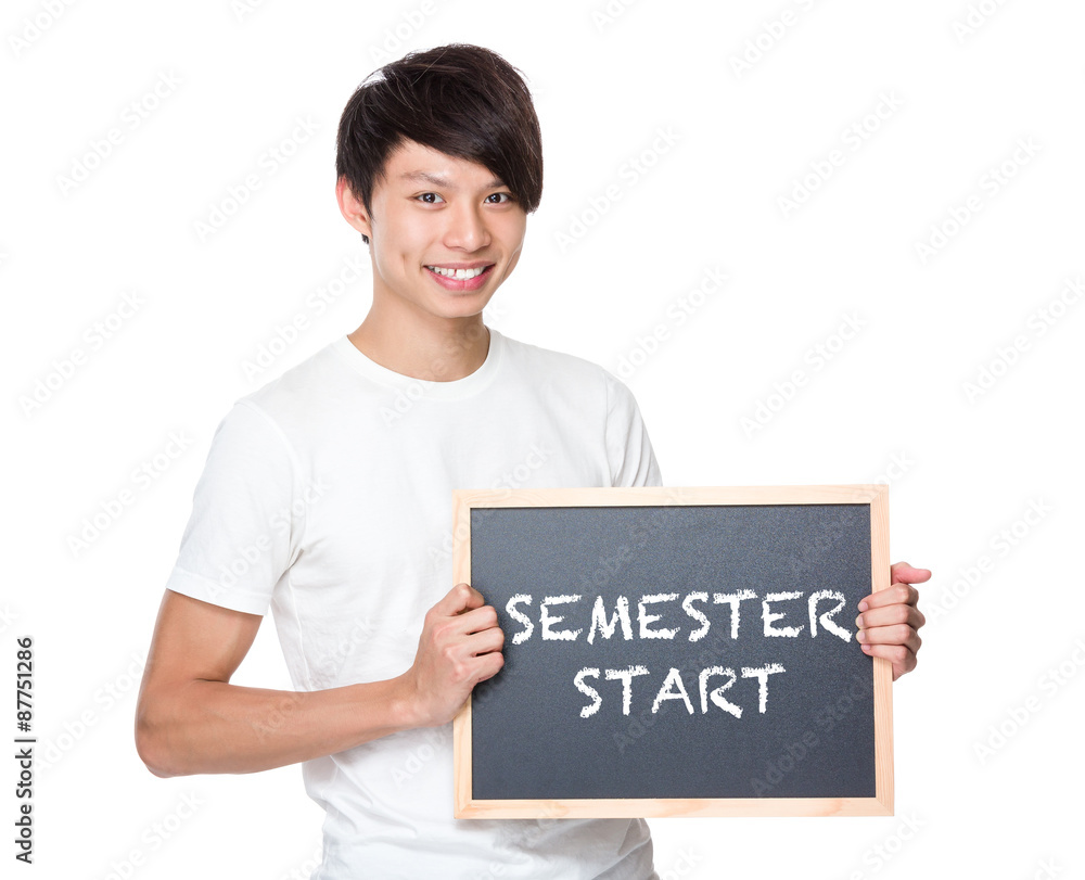 Young university student with blackboard showing phrase of semes Young university student with blackboard showing phrase of semes