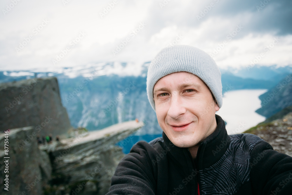 Young Tourist Taking Selfie Against The Backdrop Of The Norwegia