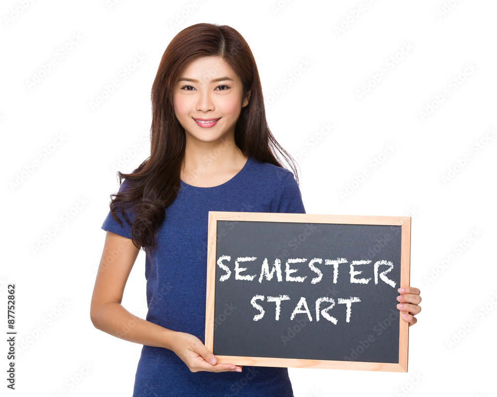 Asian woman with blackboard showing phrase of semester start Asian woman with blackboard showing phrase of semester start