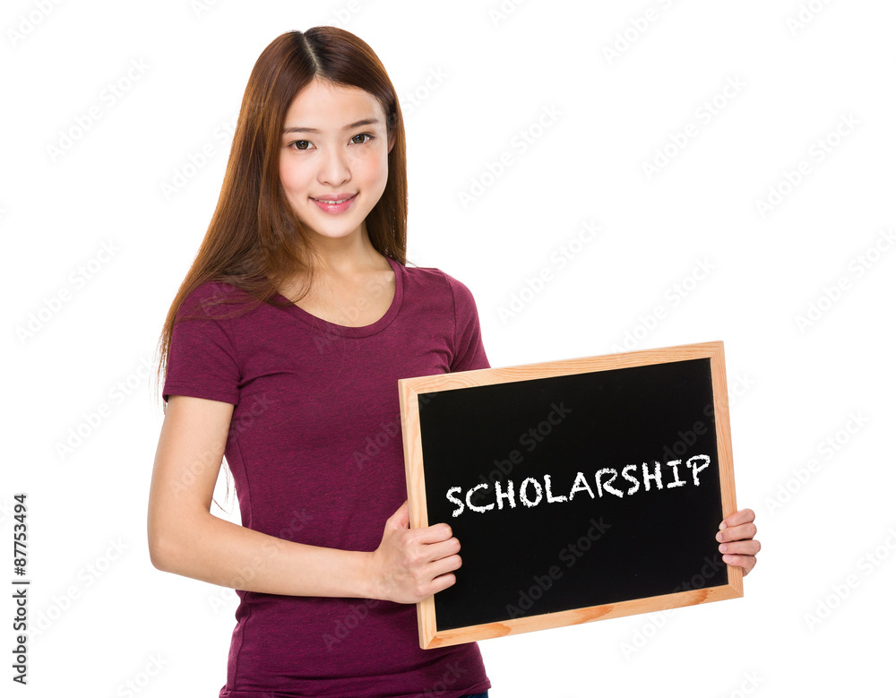 Young student hold with chalkboard showing a word scholarship Young student hold with chalkboard showing a word scholarship
