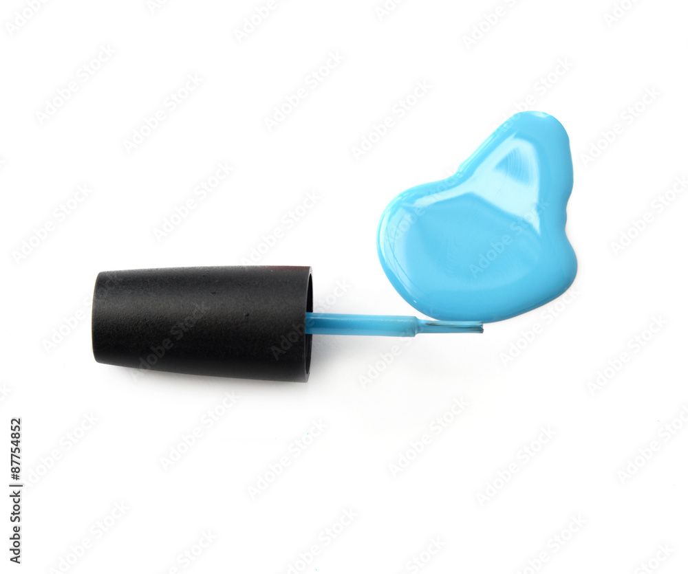 Blue nail polish with brush on white background Blue nail polish with brush on white background